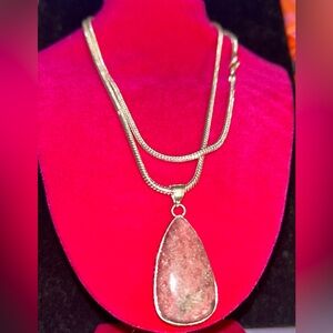 Sterling 925 sliver high quality rhodonite pendant. On 22 inch Silver tone chain